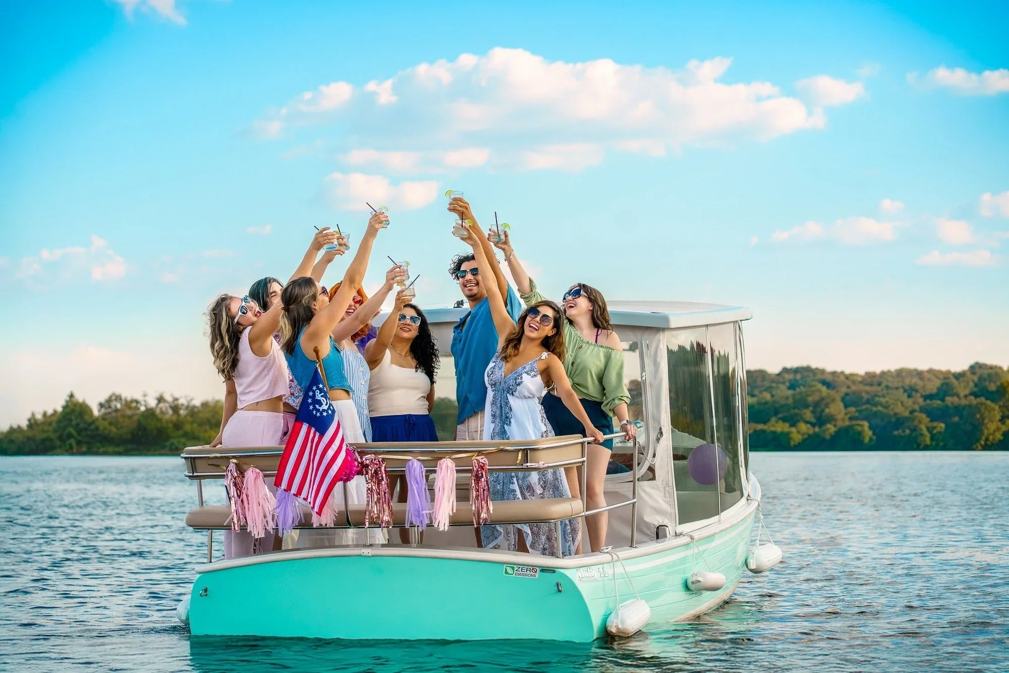 Group celebrating on an Austin Rental Boats electric Duffy cruise